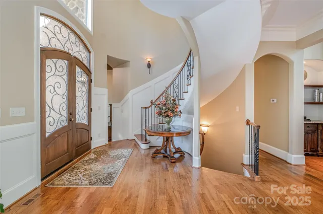 a view of a livingroom with furniture wooden floor and a rug