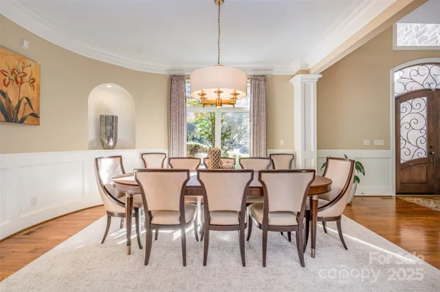 a living room with furniture a fireplace and a table