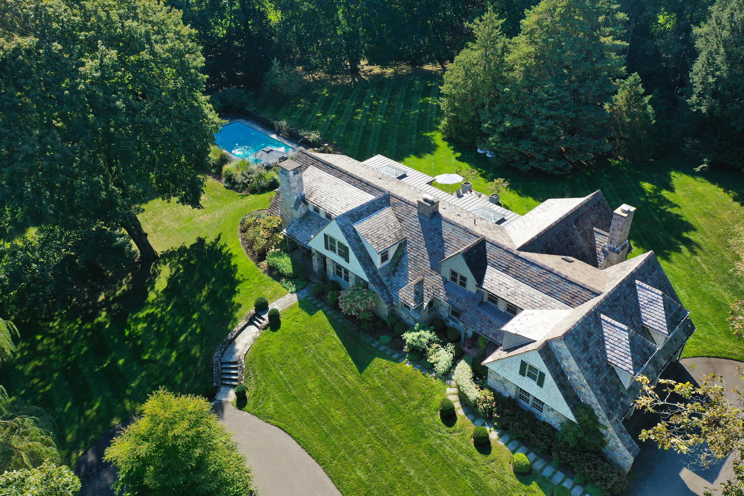 18 Wee Burn Lane Darien, CT 06820 - Photo 1 of 56 an aerial view of a house with garden space and street view