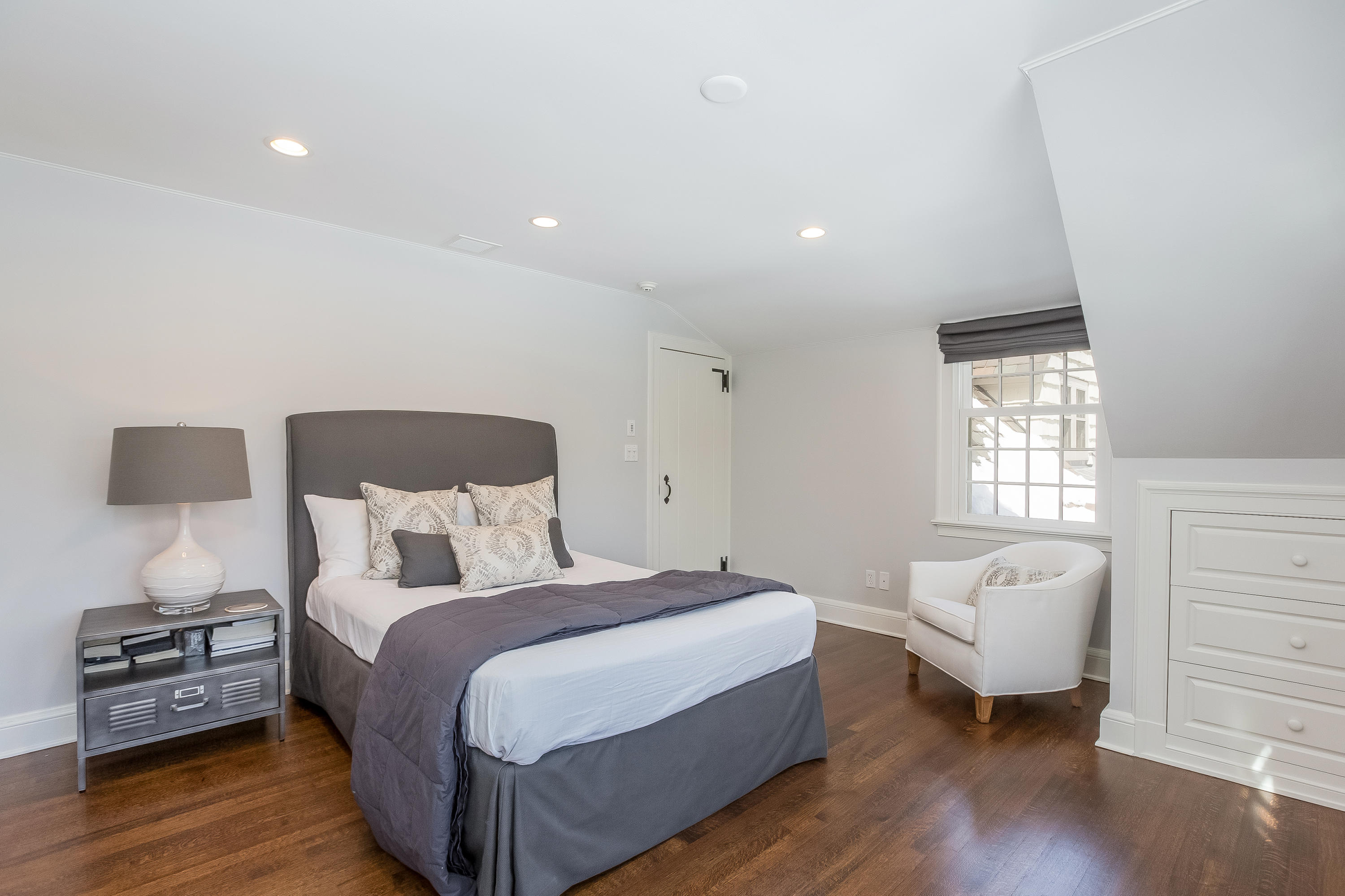 18 Wee Burn Lane Darien, CT 06820 - Photo 36 of 56 a bedroom with a bed and a couch