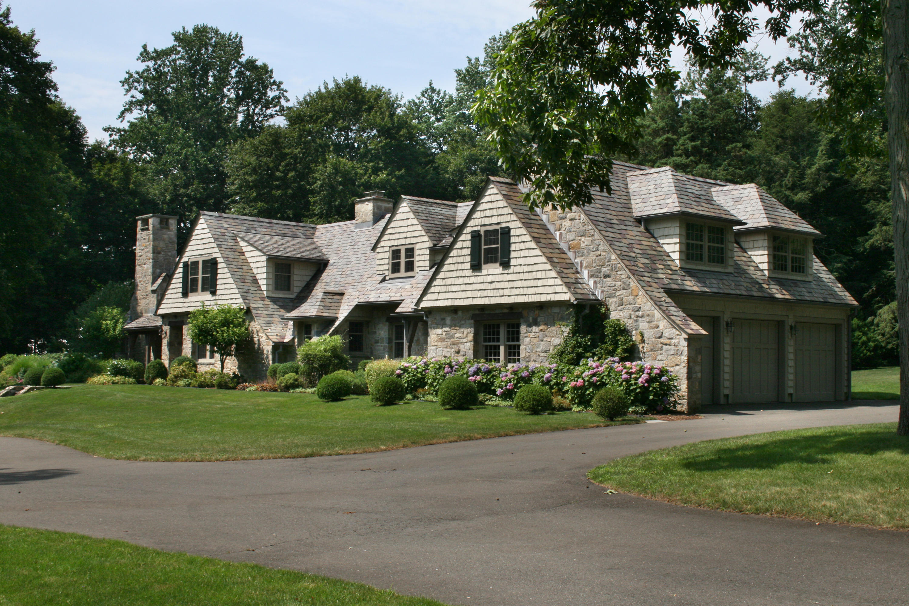 18 Wee Burn Lane Darien, CT 06820 - Photo 46 of 56 a front view of a house with a garden