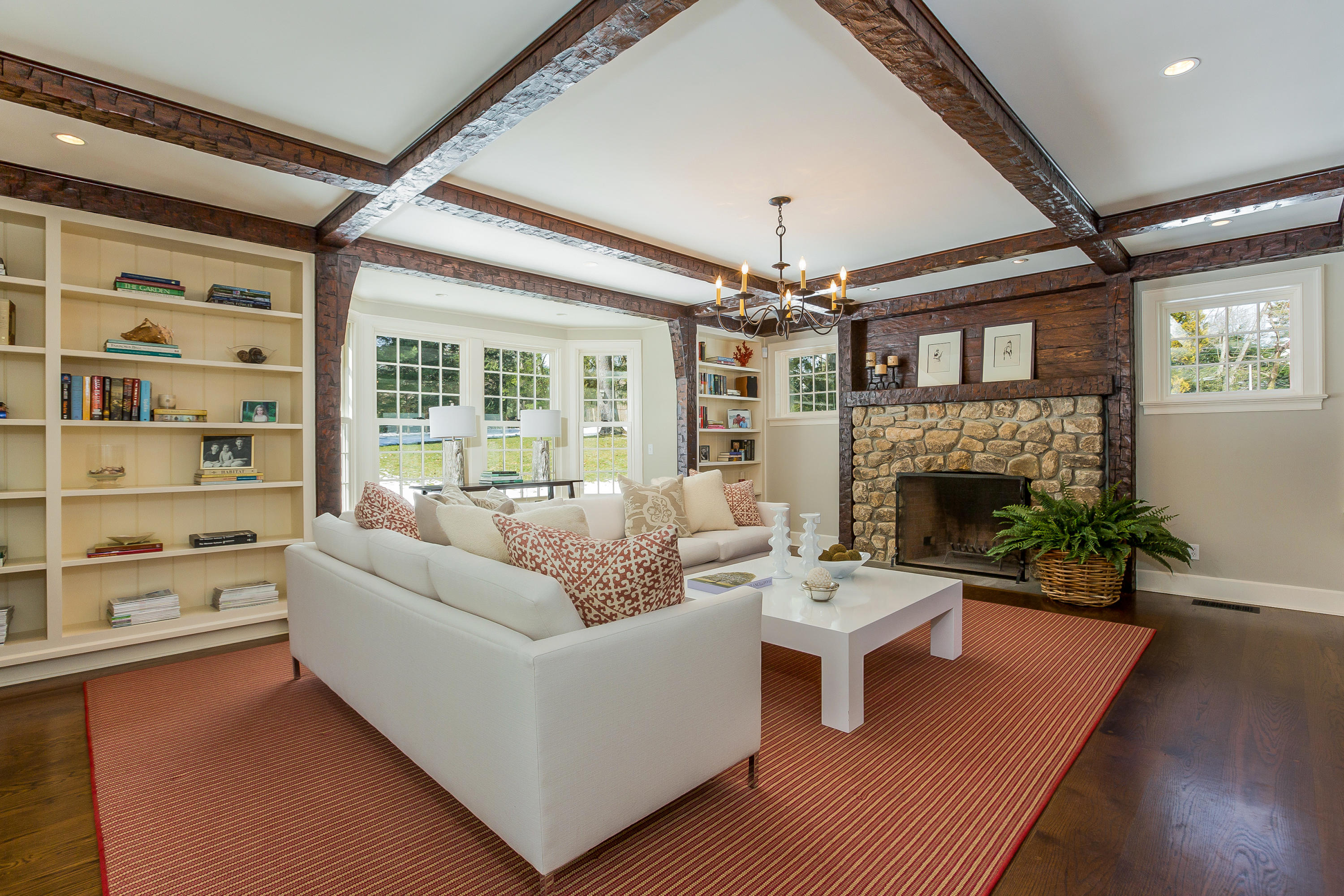 18 Wee Burn Lane Darien, CT 06820 - Photo 9 of 56 a living room with furniture a fireplace and a chandelier