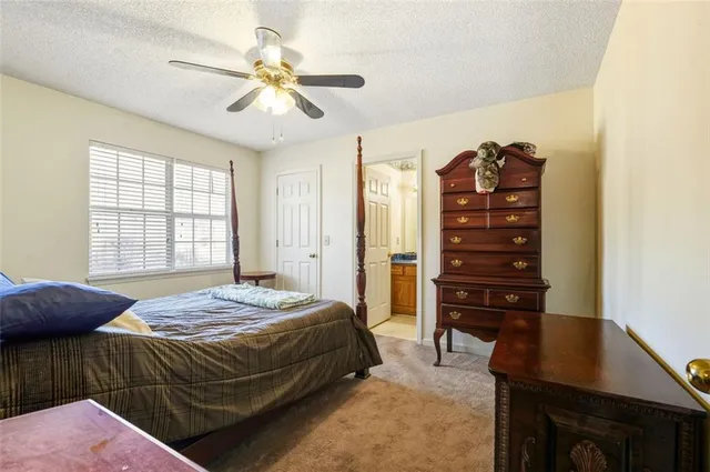 a bedroom with a bed and a table