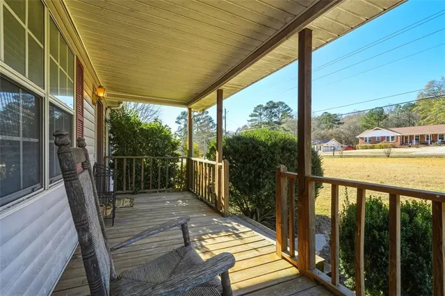 a view of a balcony with wooden floor