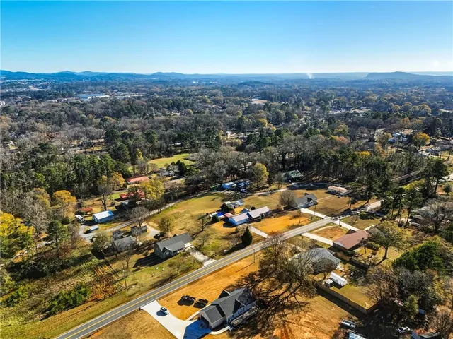an aerial view of residential houses with outdoor space