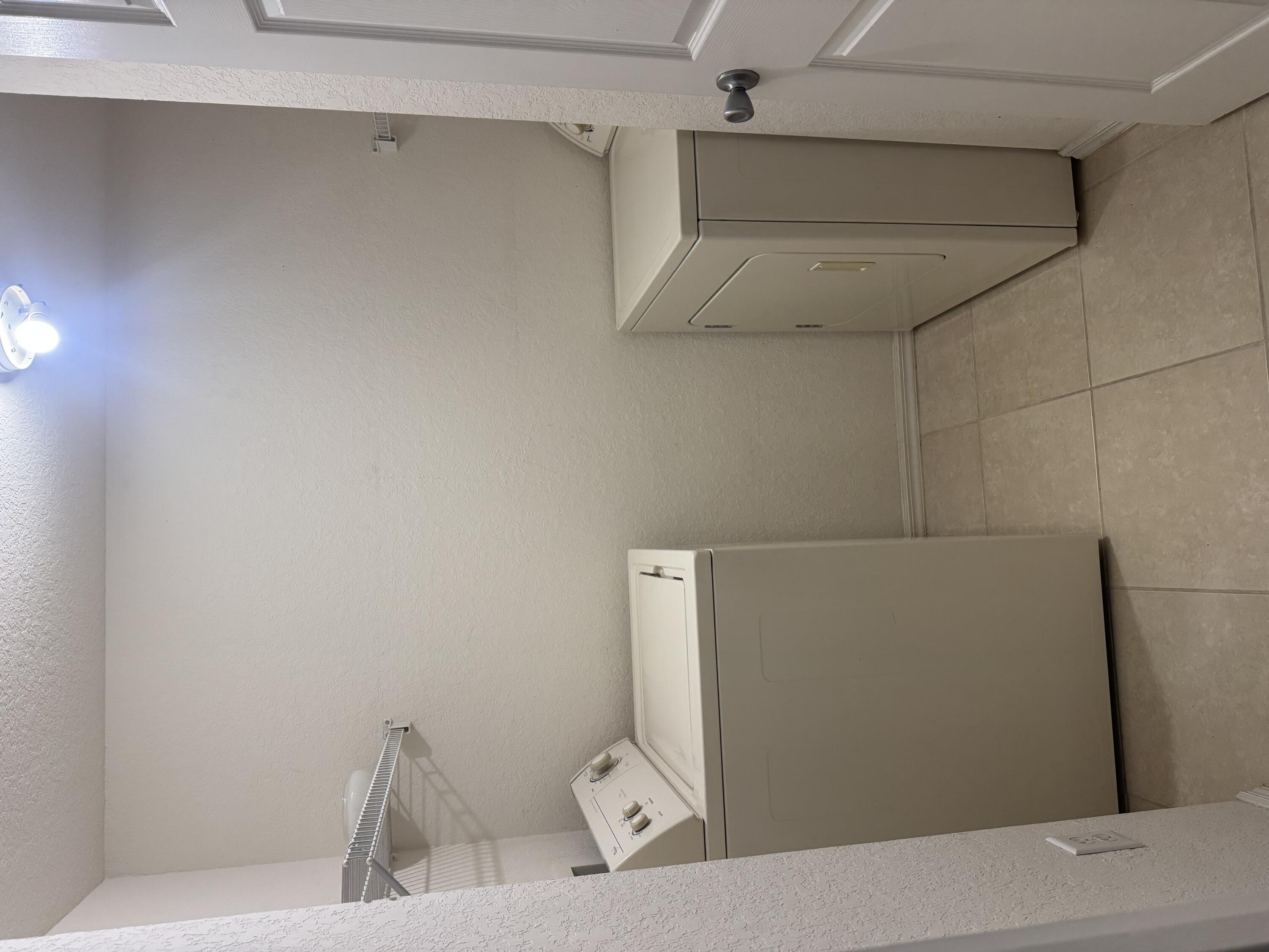 6650 West Sample Road Coral Springs, FL 33067 - Photo 14 of 15 a bathroom with a sink and toilet