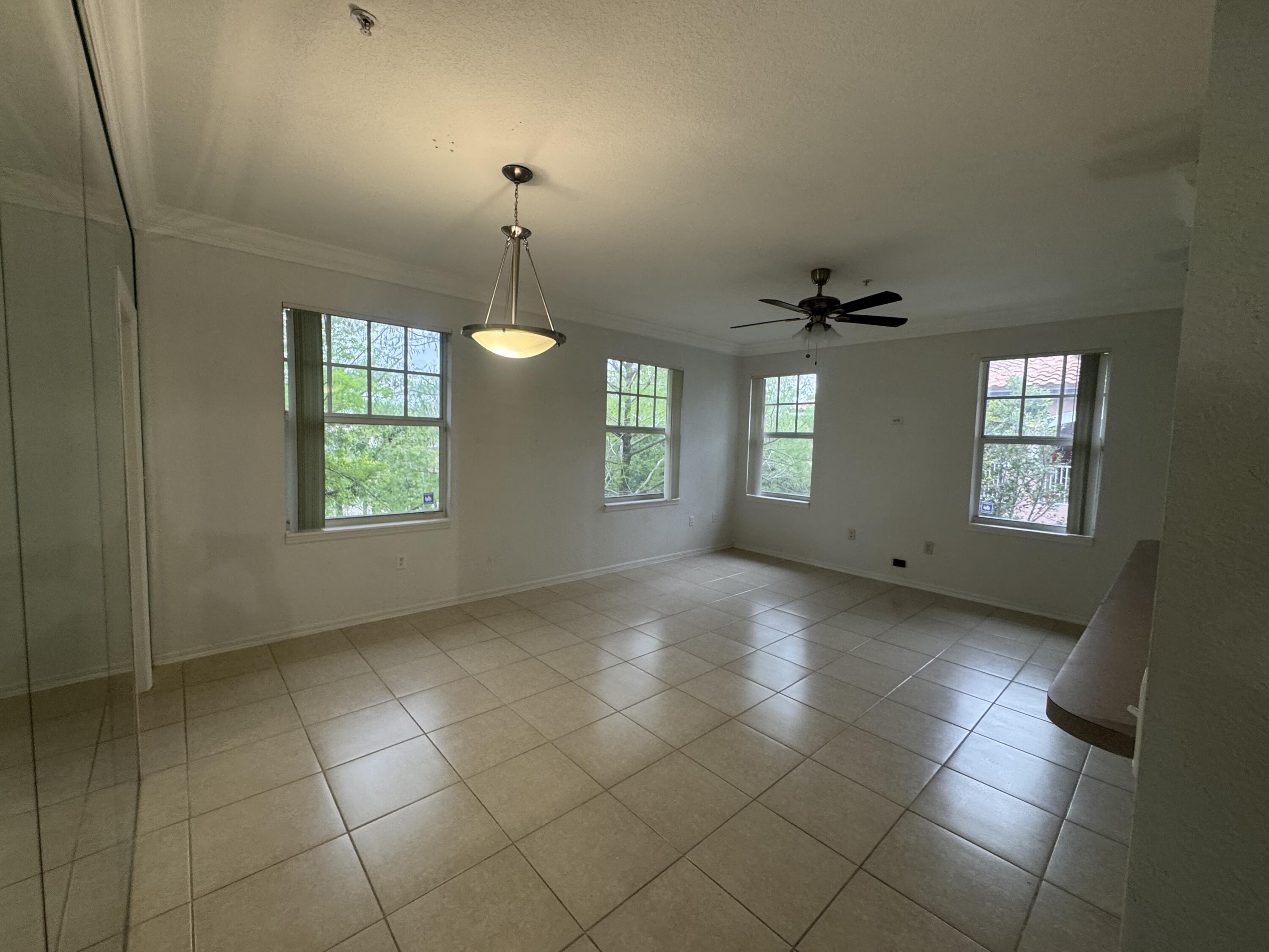 6650 West Sample Road Coral Springs, FL 33067 - Photo 4 of 15 a view of an empty room with a window