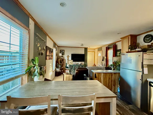 a view of a living room and dining room