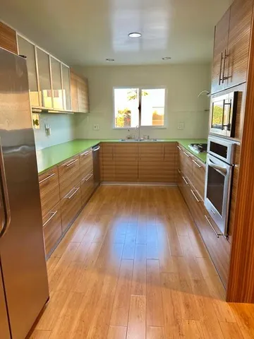 a view of a kitchen from a hallway