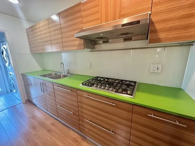 a room with washing machine and stairs