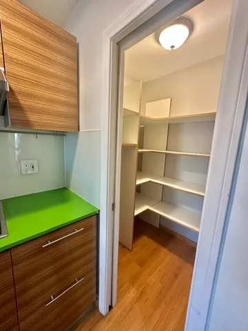 a room with window and refrigerator