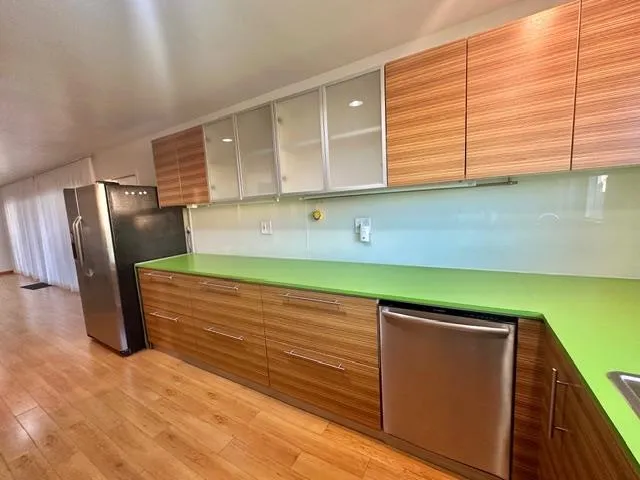 a view of a room with wooden floor