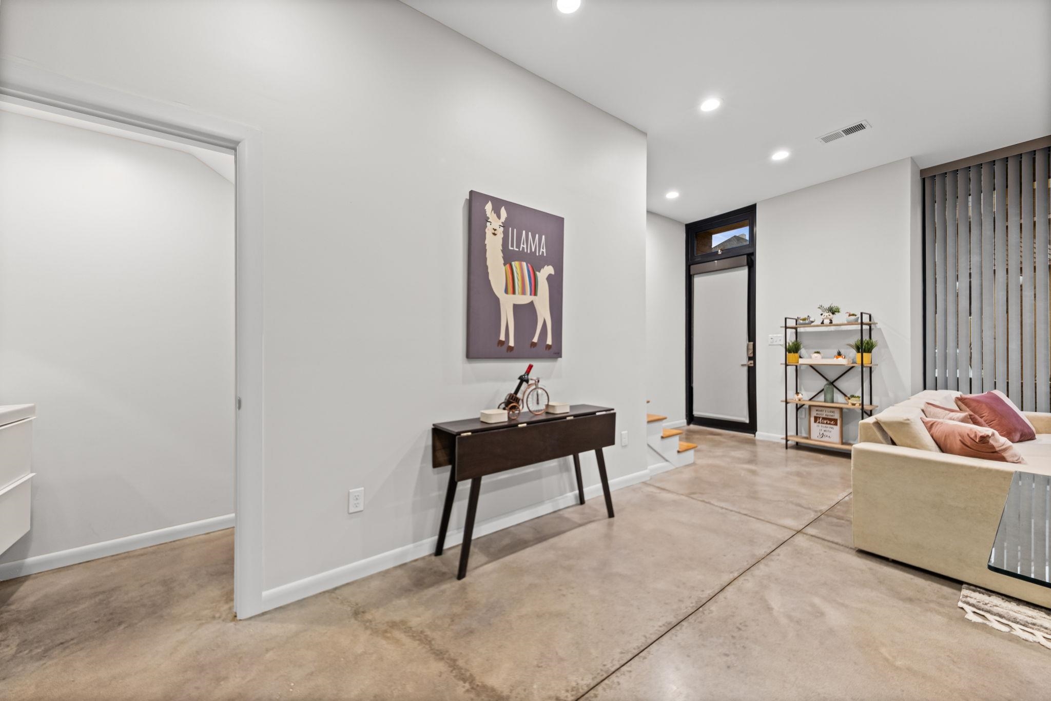 448 Tennessee Street Memphis, TN 38103 - Photo 9 of 39 Expansive open-concept living area featuring concrete flooring and recessed lighting