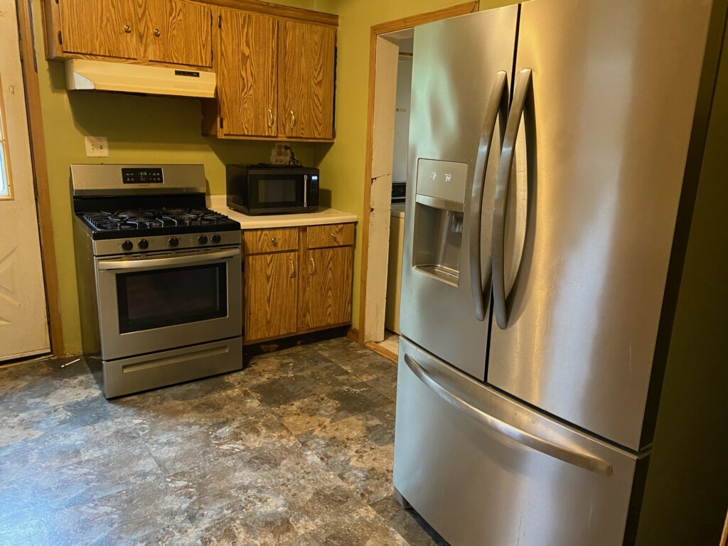 417 East Timber Street Pontiac, IL 61764 - Photo 3 of 10 a kitchen with stainless steel appliances a refrigerator stove and sink
