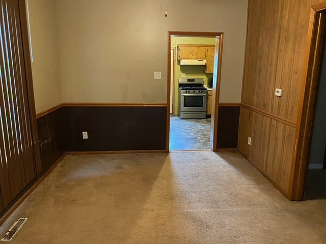 417 East Timber Street Pontiac, IL 61764 - Photo 7 of 10 a view of an empty room with wooden floor
