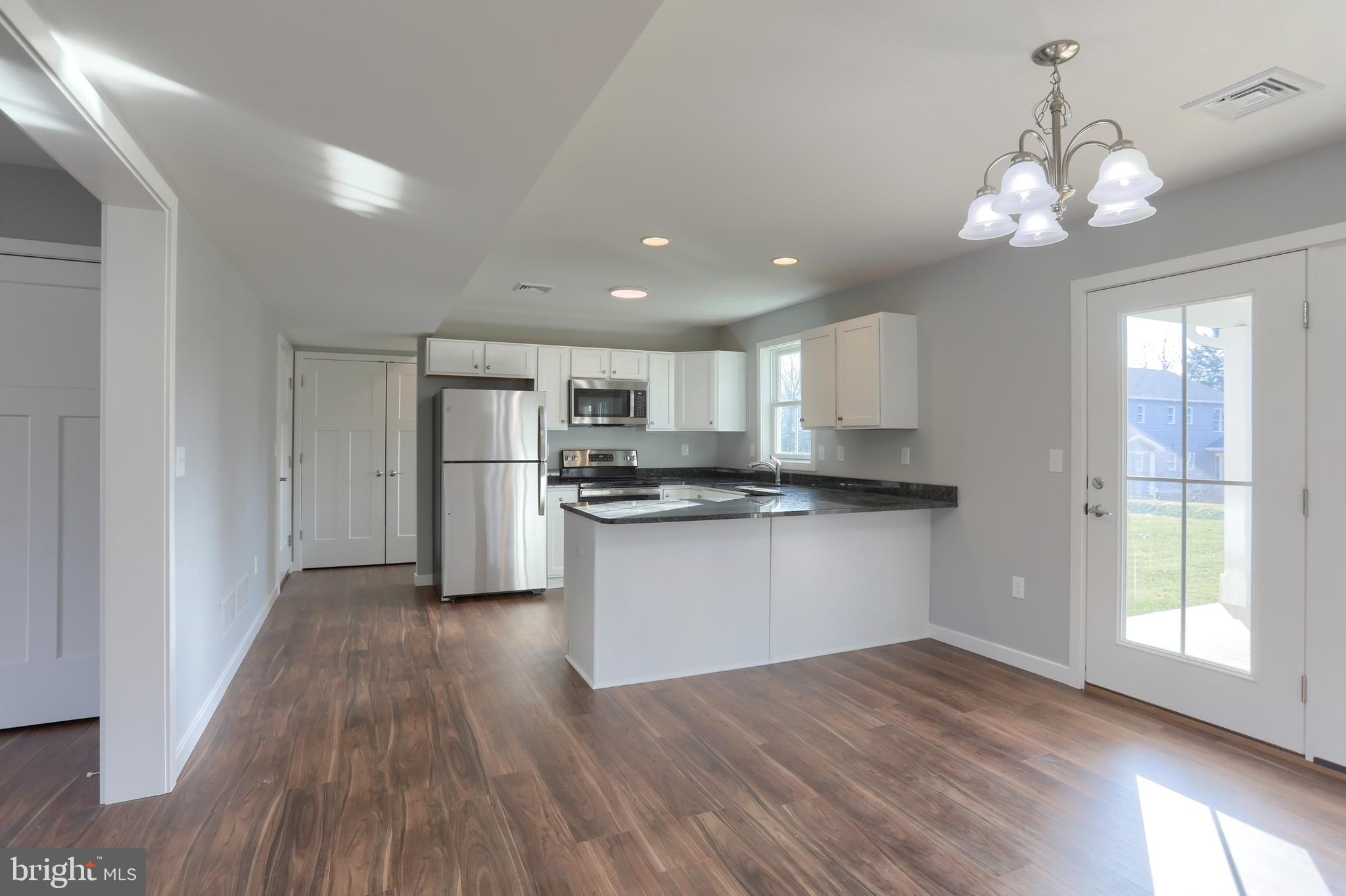 176 Lamp Post Lane Hershey, PA 17033 - Photo 11 of 33 a kitchen with a refrigerator and window
