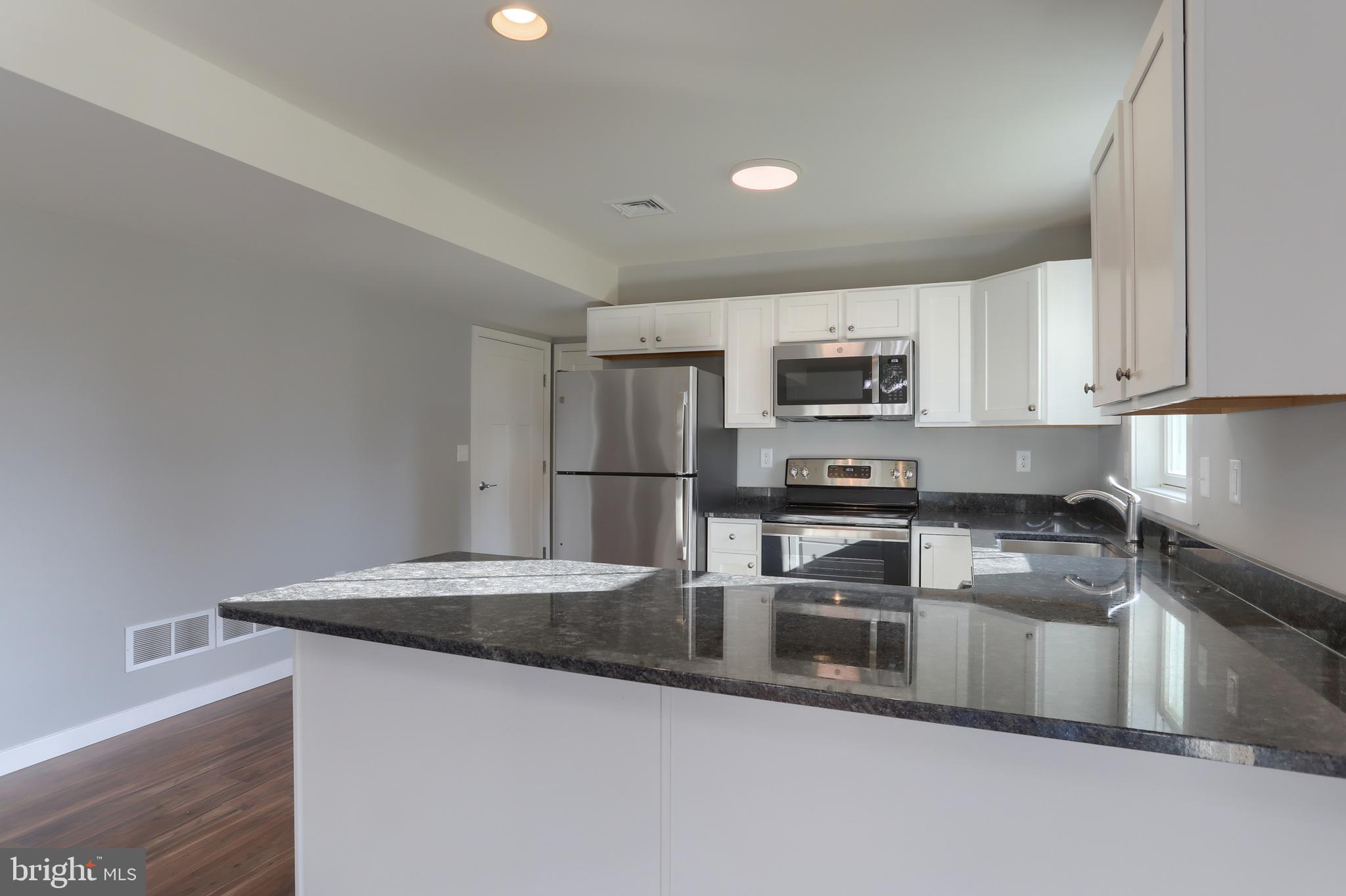 176 Lamp Post Lane Hershey, PA 17033 - Photo 14 of 33 a kitchen with granite countertop a sink and stainless steel appliances