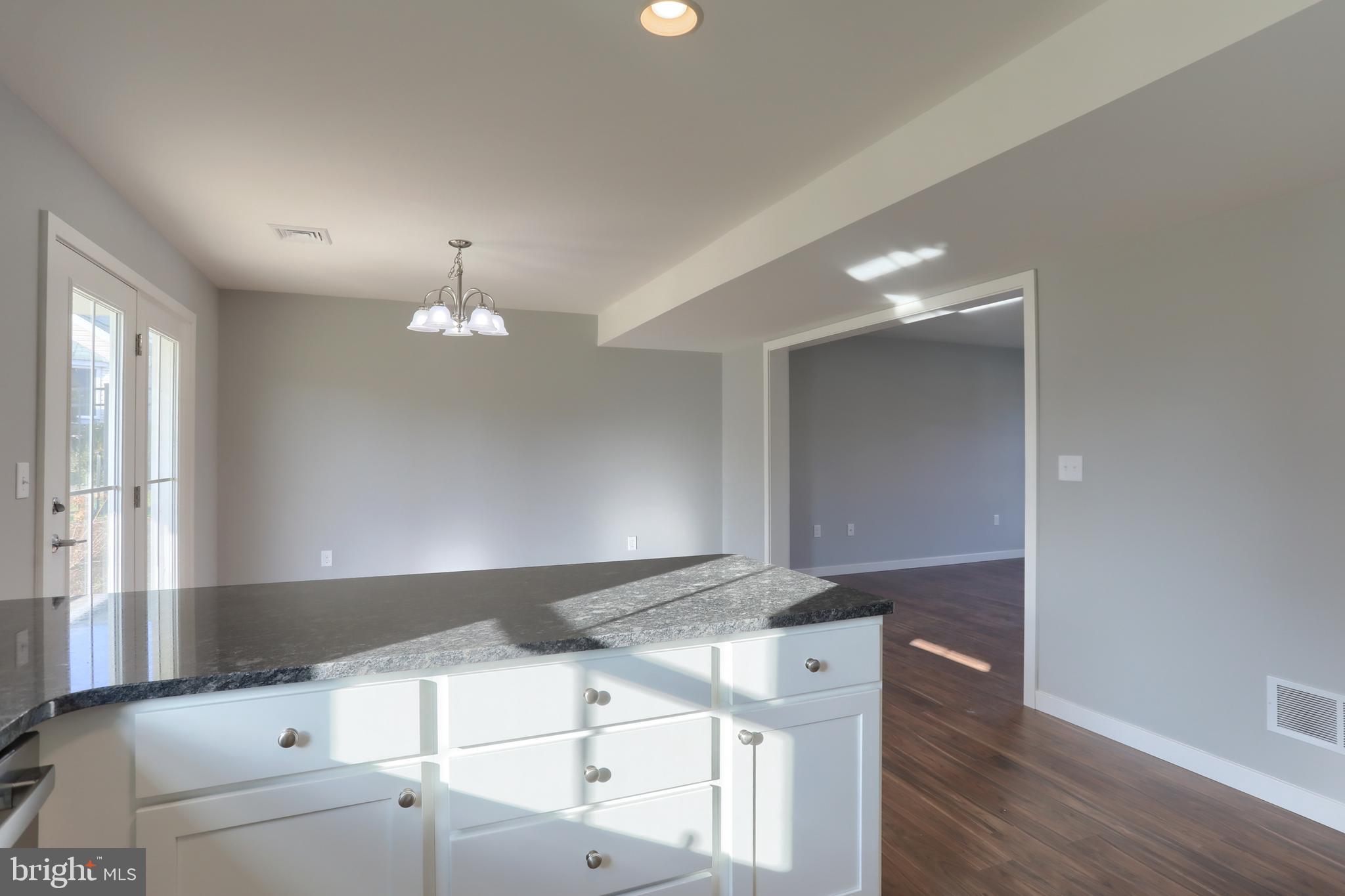 176 Lamp Post Lane Hershey, PA 17033 - Photo 17 of 33 a view of an empty room with wooden floor and a window