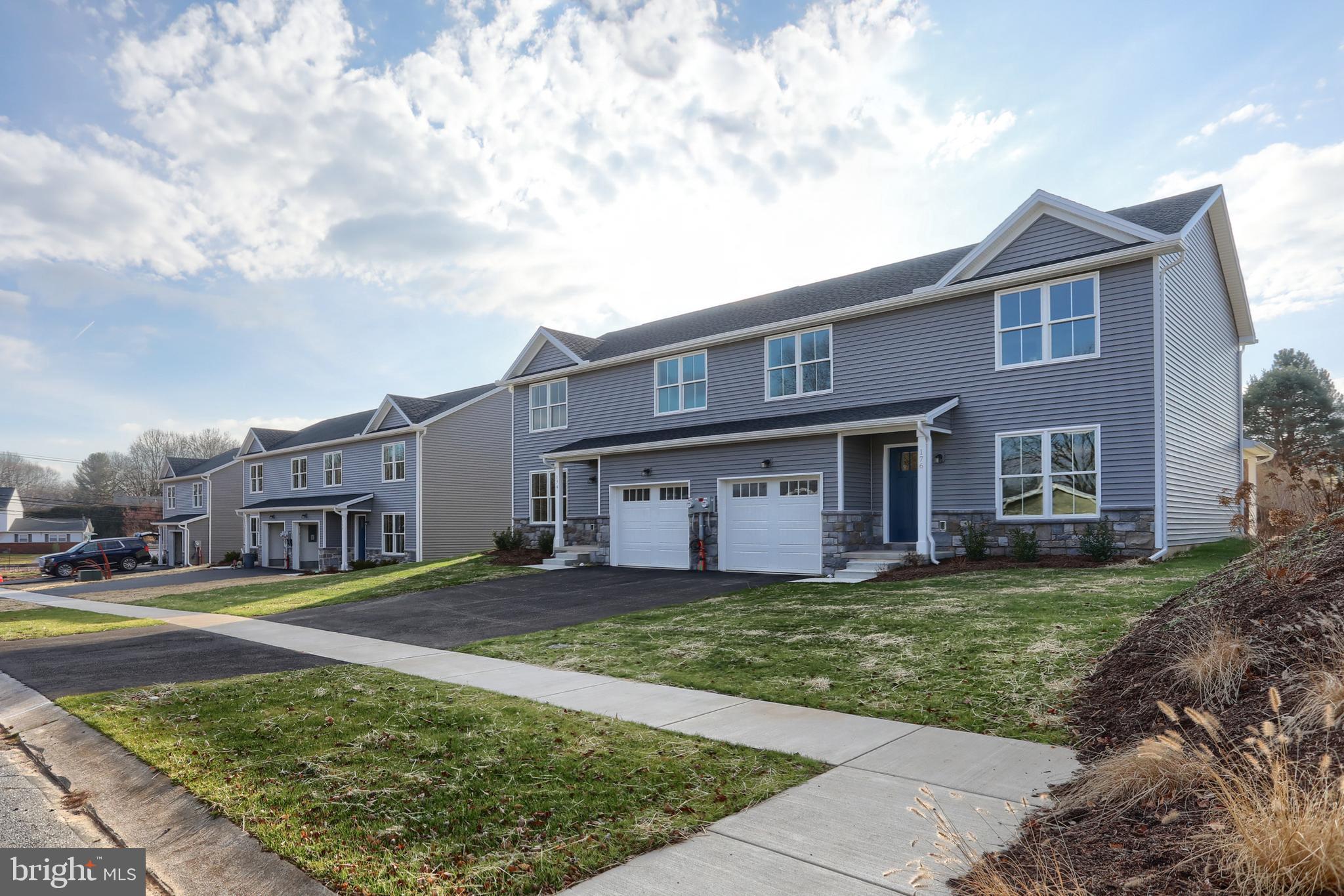 176 Lamp Post Lane Hershey, PA 17033 - Photo 2 of 33 a view of a house with a swimming pool and a yard