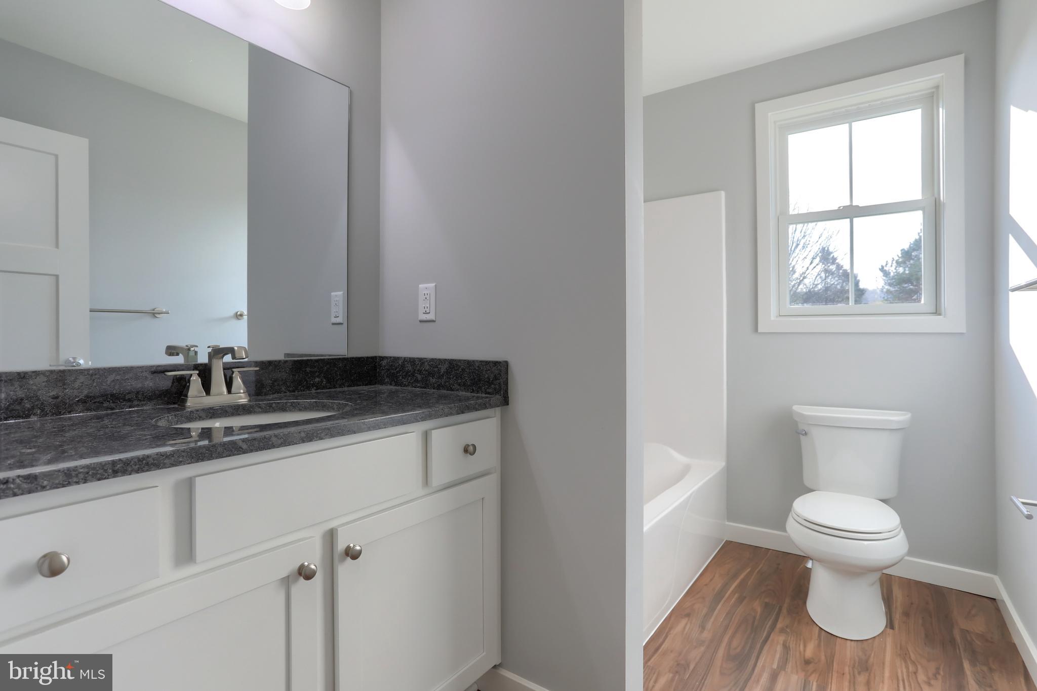 176 Lamp Post Lane Hershey, PA 17033 - Photo 29 of 33 a bathroom with a granite countertop toilet sink and mirror