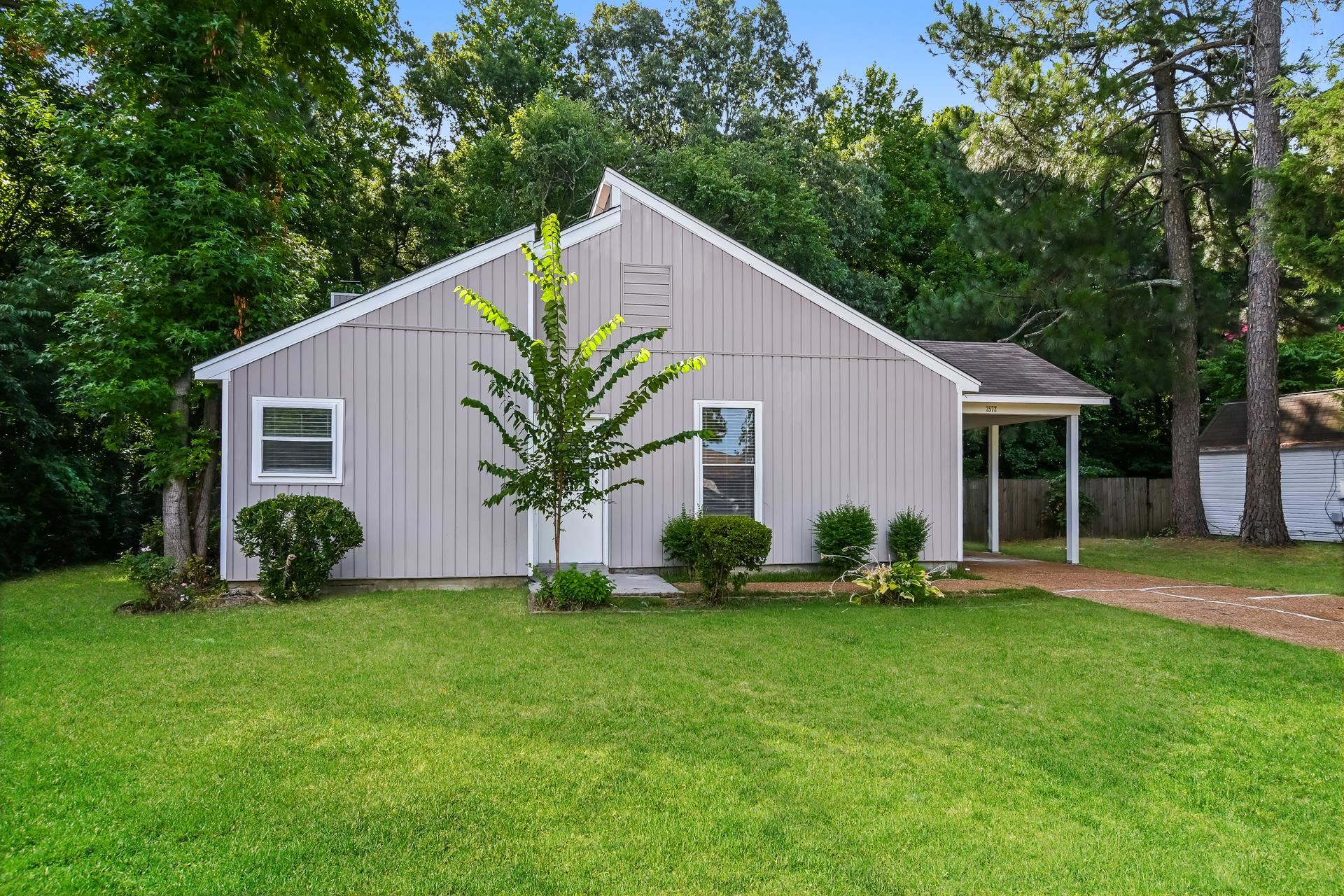 2572 Lynnfield Road Memphis, TN 38119 - Photo 1 of 21 View of side of property with a lawn