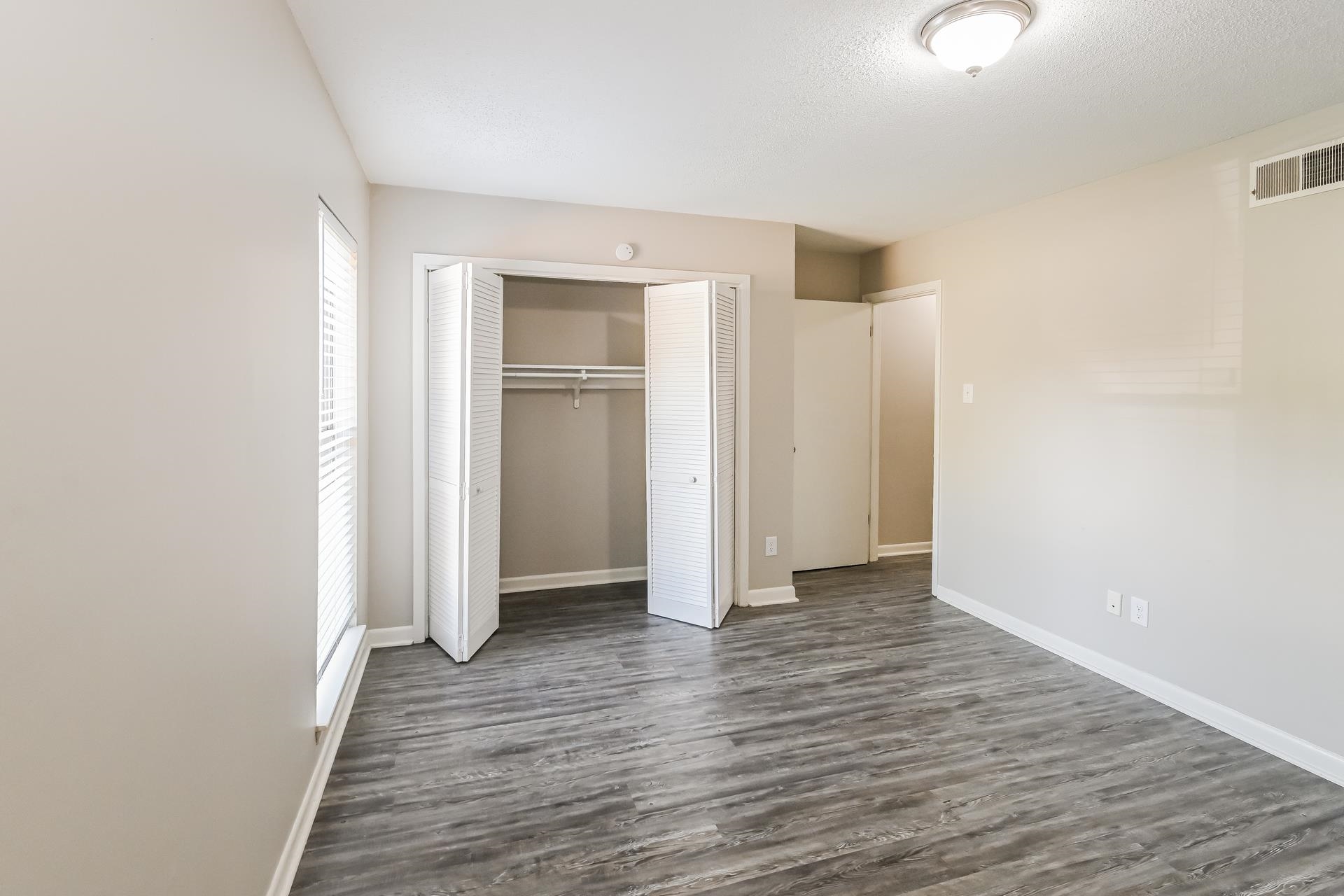 2572 Lynnfield Road Memphis, TN 38119 - Photo 17 of 21 Unfurnished bedroom with dark hardwood / wood-style floors and a closet