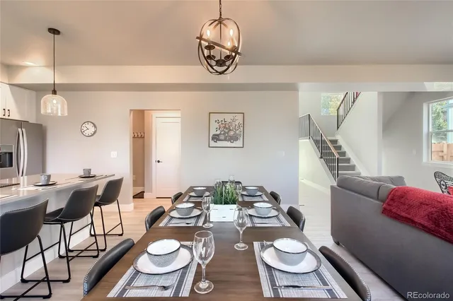 a view of a dining room furniture and wooden floor