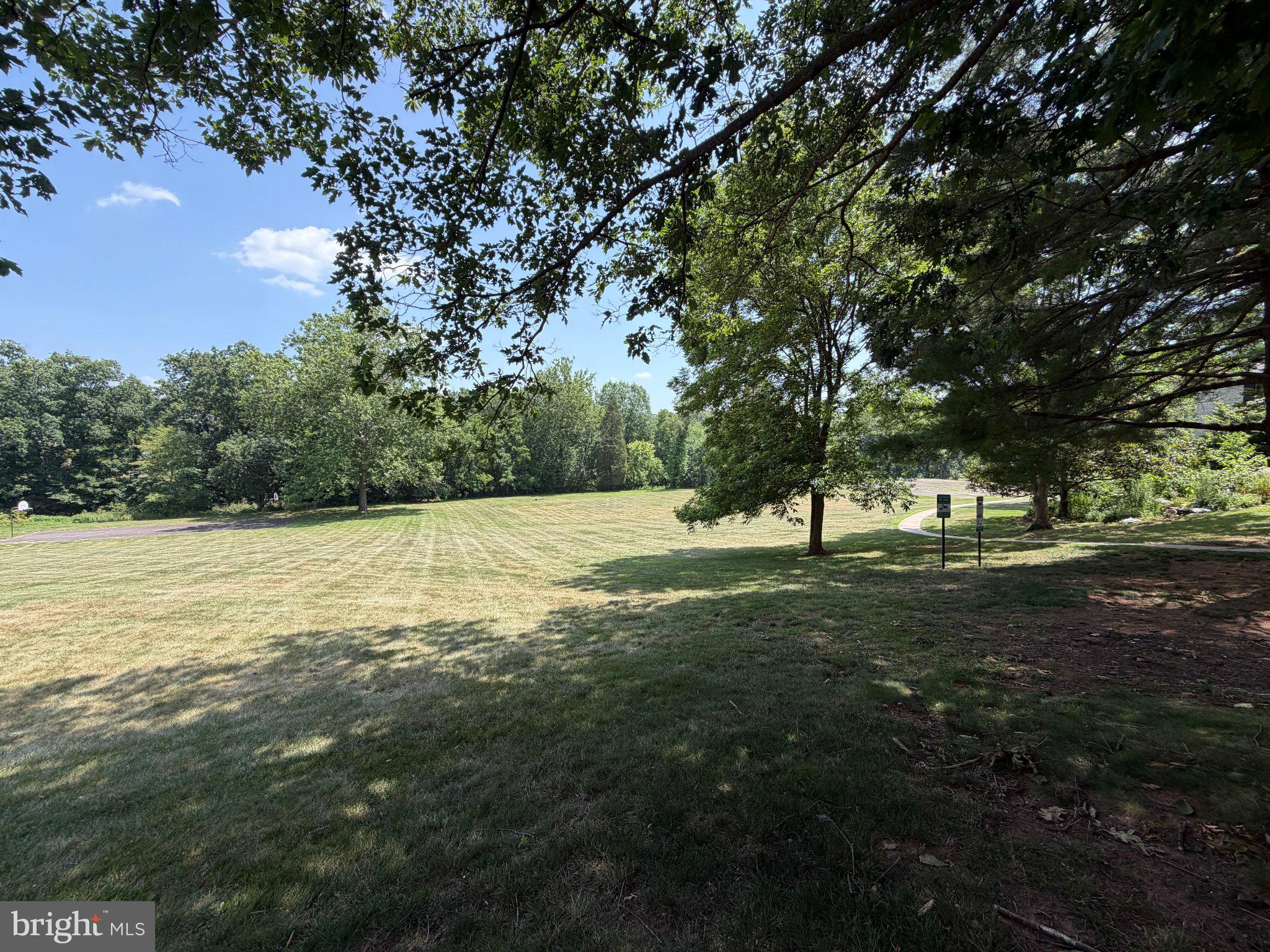 148 Providence Forge Road Royersford, PA 19468 - Photo 17 of 18 Serene green space under blue skies.