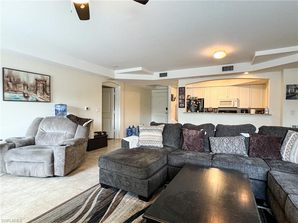 1100 Pine Ridge Road, Unit 201B Naples, FL 34108 - Photo 8 of 18 a living room with furniture and a couch
