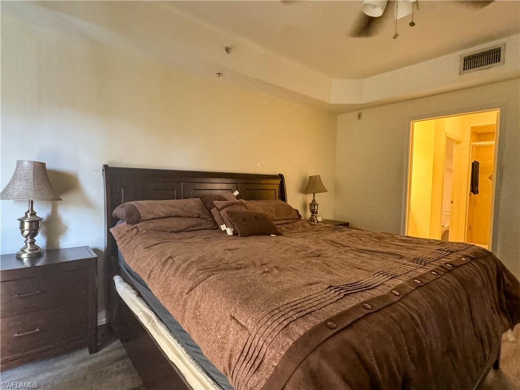 1100 Pine Ridge Road, Unit 201B Naples, FL 34108 - Photo 10 of 18 a bedroom with a bed and window