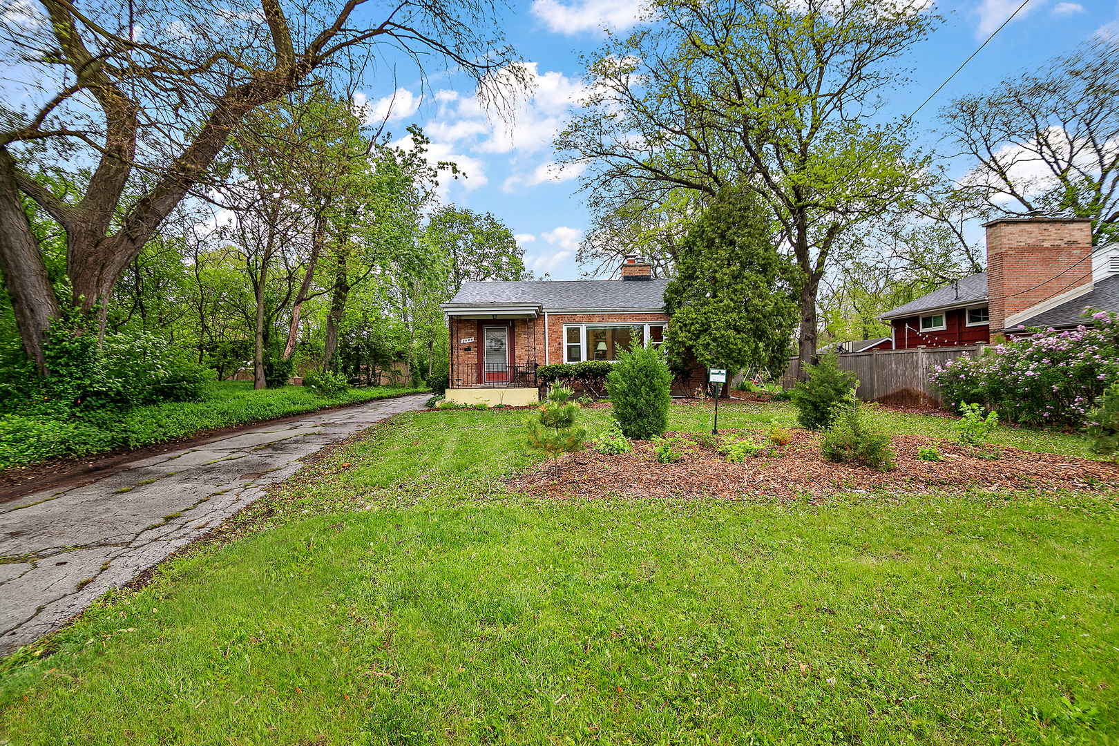 2444 183rd Street Homewood, IL 60430 - Photo 2 of 25 a front view of a house with garden