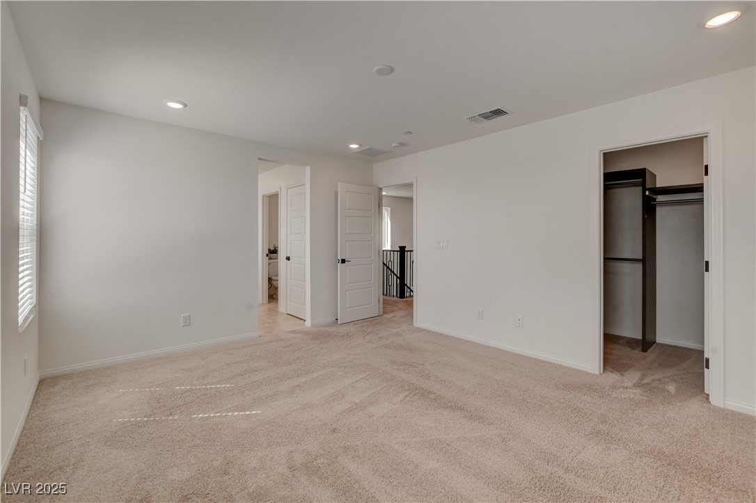 5406 Zacatin Court Las Vegas, NV 89166 - Photo 12 of 23 Unfurnished bedroom with baseboards, visible vents