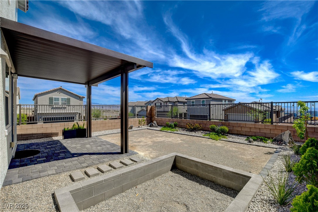 5406 Zacatin Court Las Vegas, NV 89166 - Photo 21 of 23 View of patio with a residential view and a fenced