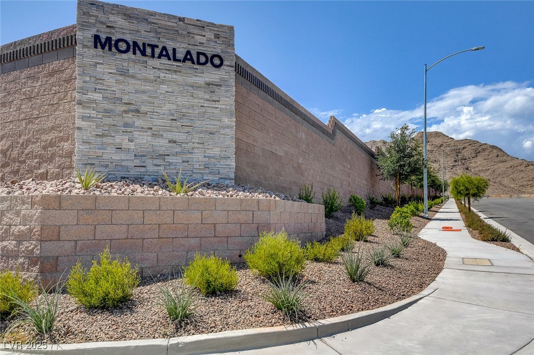 5406 Zacatin Court Las Vegas, NV 89166 - Photo 22 of 23 Community / neighborhood sign with fence and a mou