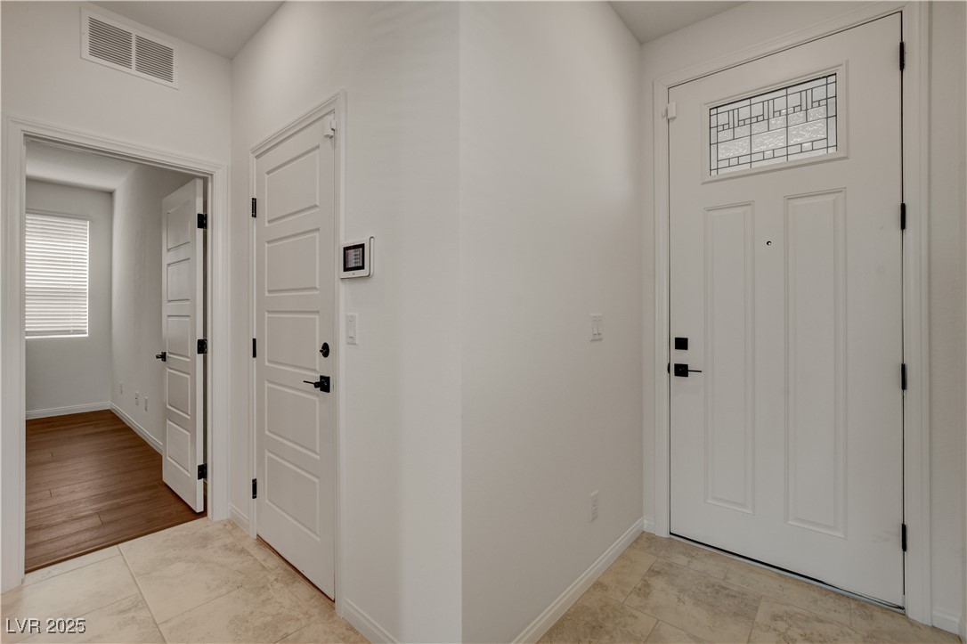 5406 Zacatin Court Las Vegas, NV 89166 - Photo 4 of 23 Entrance foyer with visible vents and baseboards