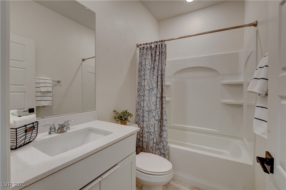 5406 Zacatin Court Las Vegas, NV 89166 - Photo 5 of 23 Bathroom with shower / bath combo, vanity, and toi