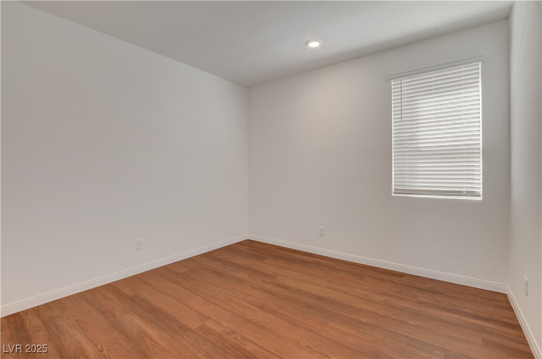 5406 Zacatin Court Las Vegas, NV 89166 - Photo 6 of 23 Spare room featuring recessed lighting, wood finis