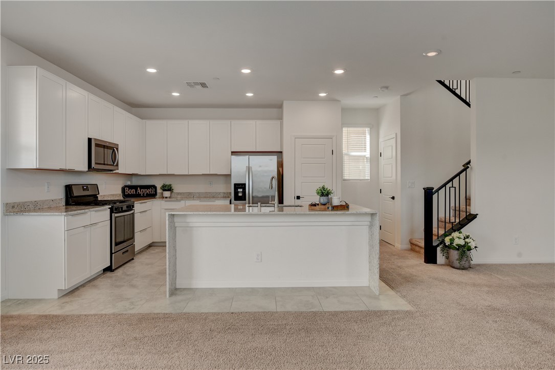 5406 Zacatin Court Las Vegas, NV 89166 - Photo 8 of 23 Kitchen with an island with sink, stainless steel