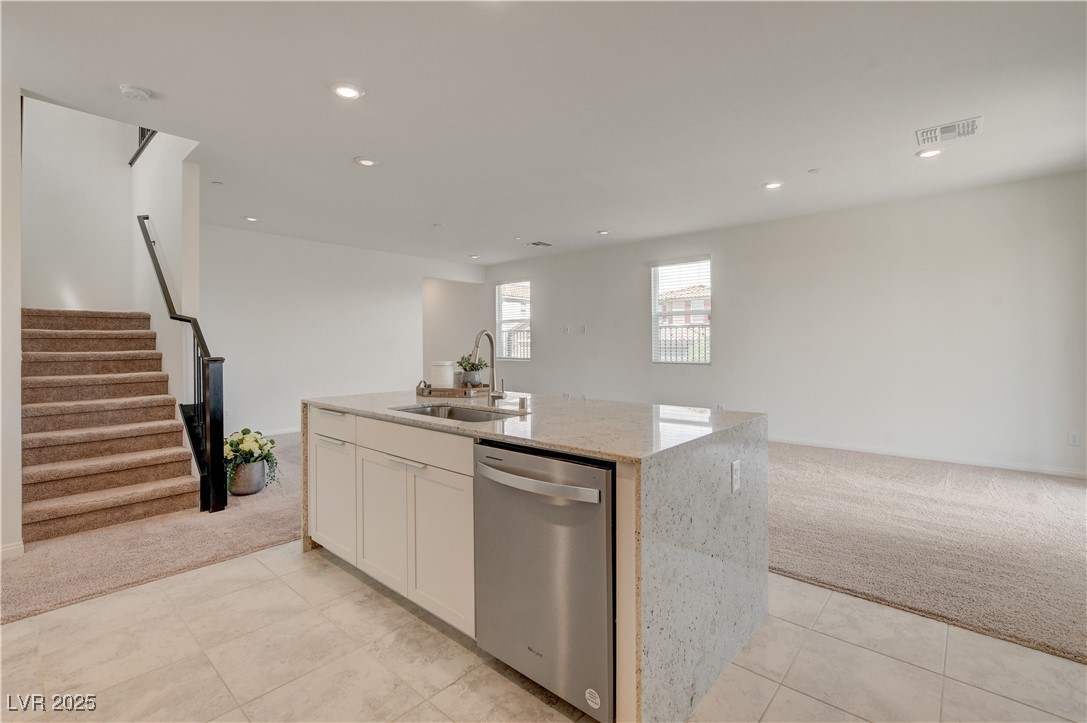 5406 Zacatin Court Las Vegas, NV 89166 - Photo 9 of 23 Kitchen featuring a sink, visible vents, light col