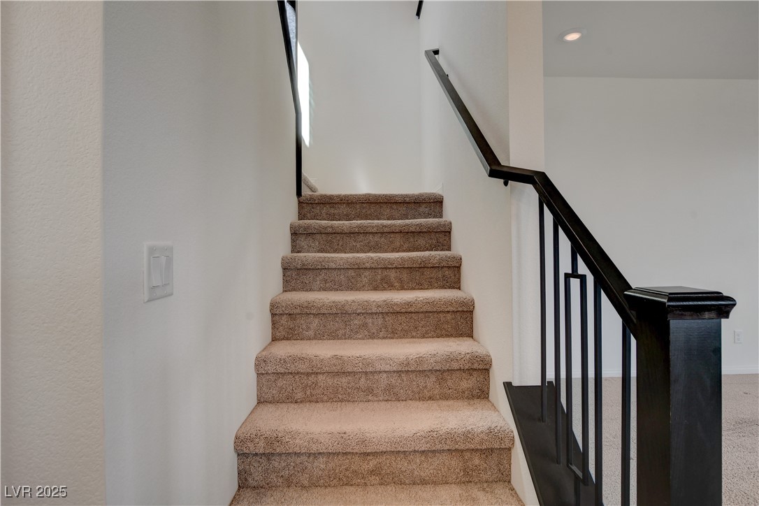 5406 Zacatin Court Las Vegas, NV 89166 - Photo 10 of 23 Stairs with recessed lighting and carpet