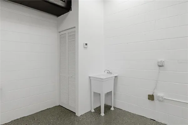 a view of a hallway with a wooden cabinets