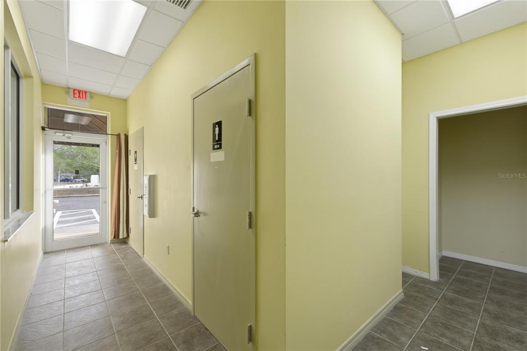 7535 Southwest 62nd Court, Unit B Ocala, FL 34476 - Photo 13 of 25 a view of a hallway with a wooden cabinets