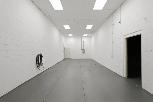 a view of a hallway with white walls