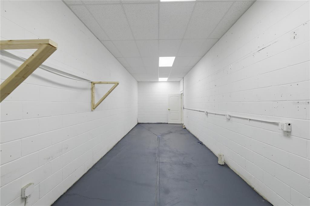 7535 Southwest 62nd Court, Unit B Ocala, FL 34476 - Photo 19 of 25 a view of a hallway with white walls