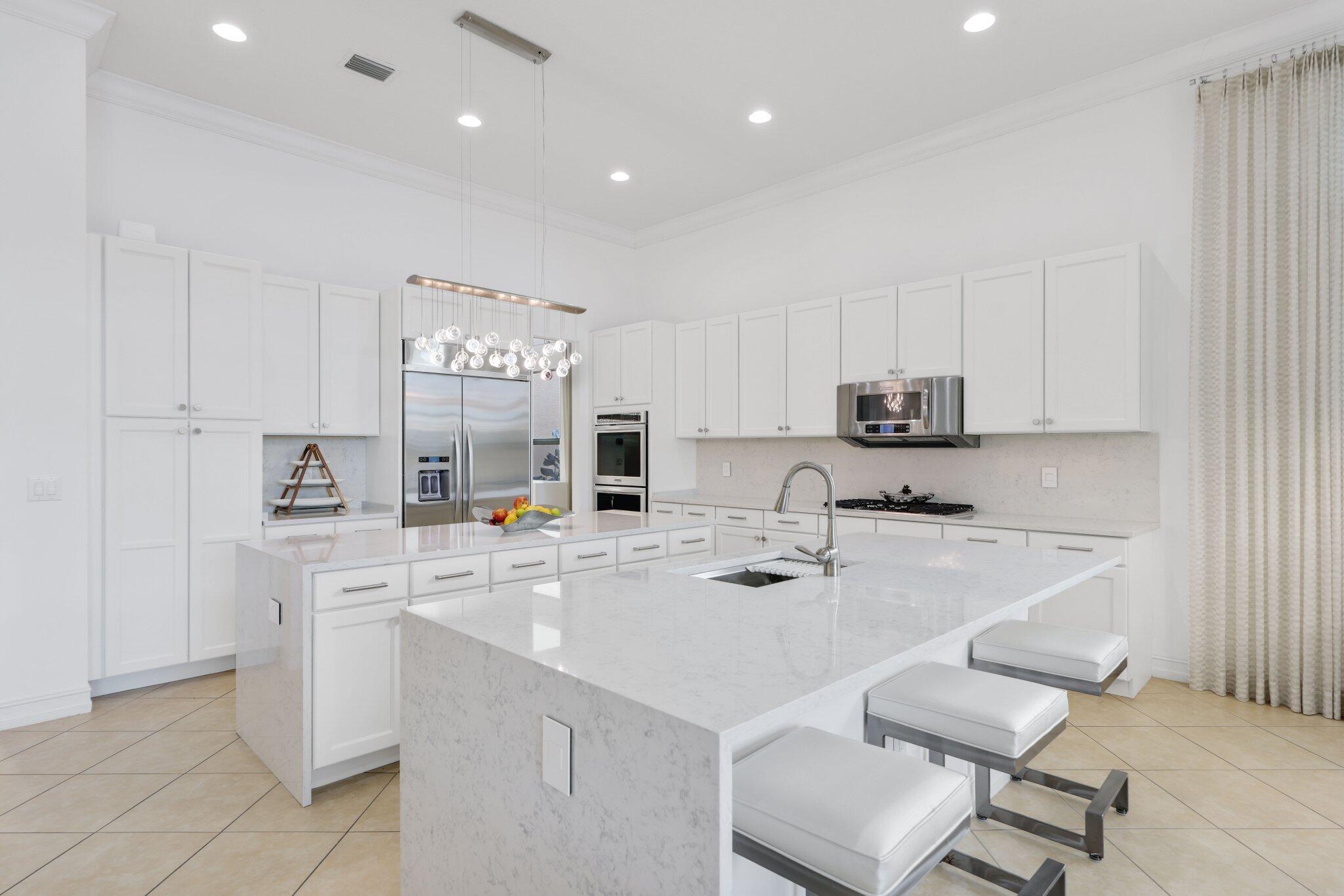 8539 Lewis River Road Delray Beach, FL 33446 - Photo 12 of 49 Open Kitch with Quartzite Countertops