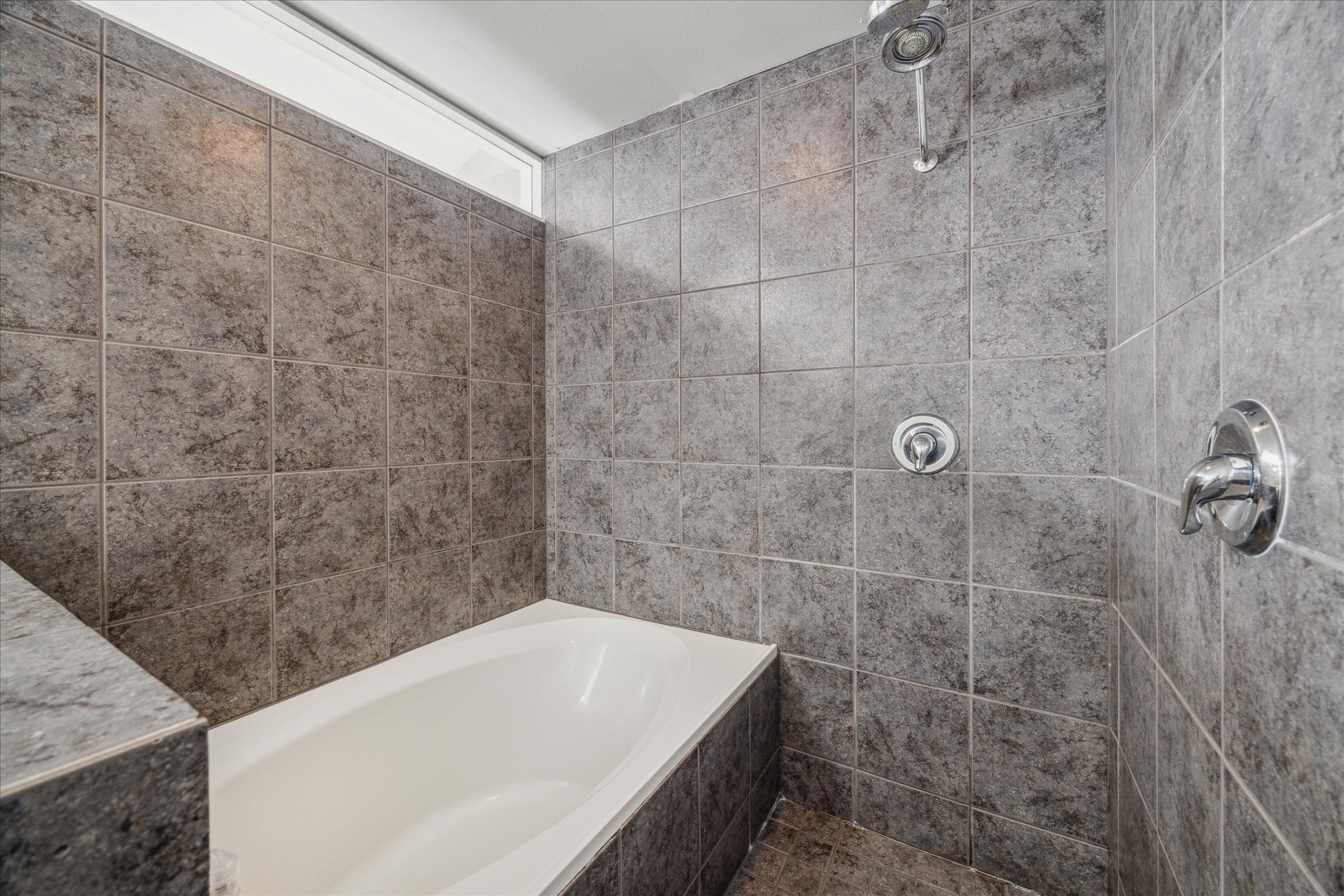 6111 Gehring Street Houston, TX 77021 - Photo 13 of 16 a bath tub sitting in a bathroom and a shower