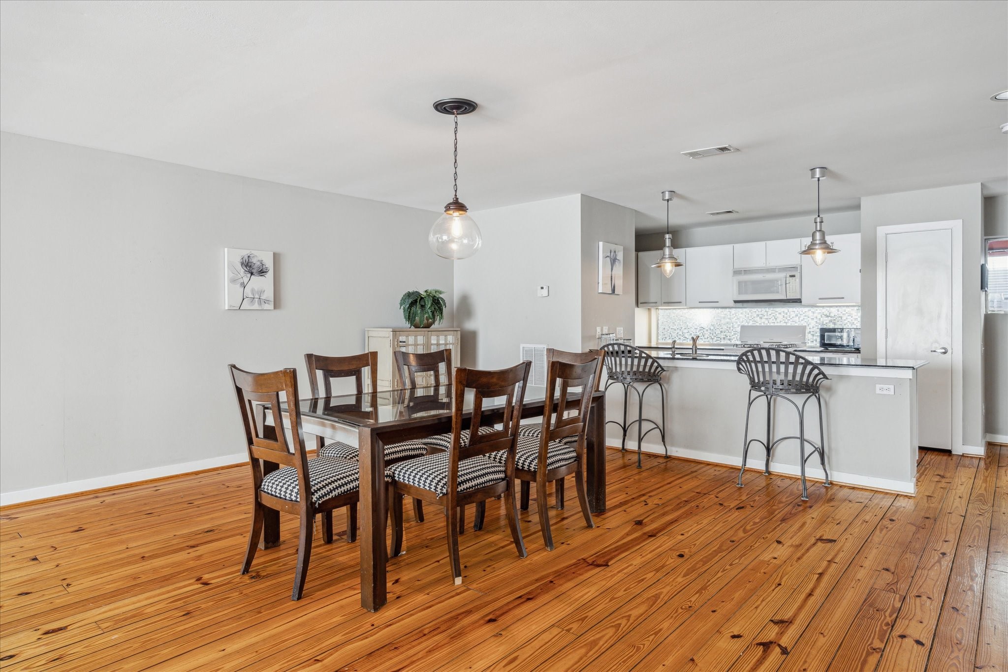 6111 Gehring Street Houston, TX 77021 - Photo 6 of 16 a view of a dining room with furniture and wooden floor