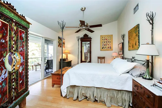a bedroom with a bed a dresser and book shelf