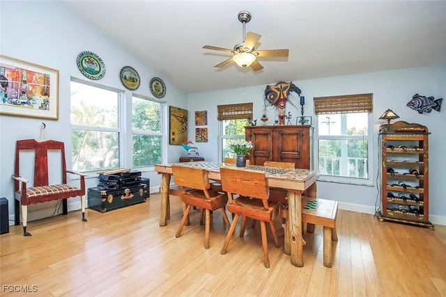 a view of a dining room with furniture window and wooden floor