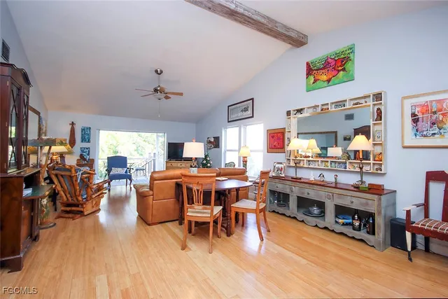 a living room with furniture dining table and a fireplace